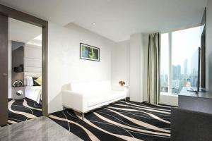 Uma cama ou camas num quarto em Hotel Madera Hong Kong