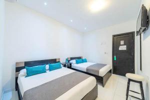 Postel nebo postele na pokoji v ubytování Hotel Mar di Plata