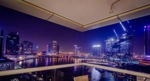 a view of a city skyline at night at OSKENA Vacation Homes - Waterfront Downtown in Dubai