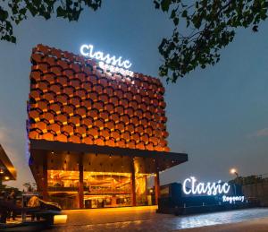 a clamsico building with neon signs on it at Classic Regency in Alleppey