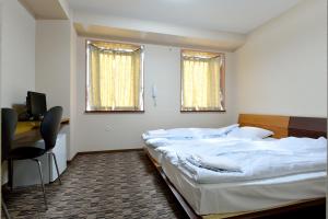 Ein Bett oder Betten in einem Zimmer der Unterkunft Juyoh Hotel