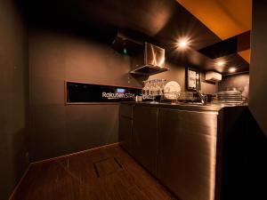 a kitchen with a counter and a counter top at Rakuten STAY x EAGLES 101 with terrace in Sendai