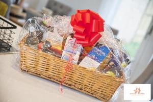 a basket filled with different types of candy at St Ives Bay - Immaculate Brand New 3Bed - Free Parking - Beach - WiFi in Hayle