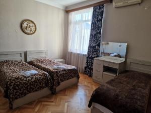 Postel nebo postele na pokoji v ubytování CATTALEYA