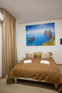 Ένα ή περισσότερα κρεβάτια σε δωμάτιο στο K-Home