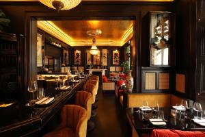 a restaurant with a long row of tables at No131 The Promenade in Cheltenham