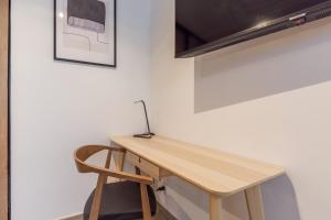 Telewizja i/lub zestaw kina domowego w obiekcie Calme absolu, terrasse et parking entre Paris et Disney