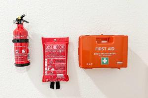 a fire hydrant and a fire extinguisher next to a fire extinguisher at Spacious Apartment with Balcony & WiFi in Wetzlar