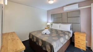 Postel nebo postele na pokoji v ubytování Executive Hideaway