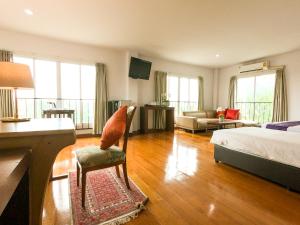 En eller flere senge i et værelse på Hotela Boutique Resort