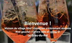 a close up of two glasses of beer at Maison de village rénovée ! in Le Grau-du-Roi