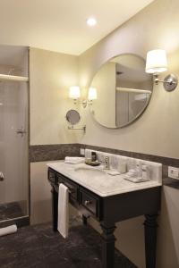 a bathroom with a sink and a mirror at Miramar By Windsor Copacabana in Rio de Janeiro