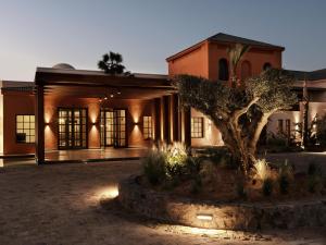 a building with a tree in front of it at The Chedi El Gouna in Hurghada