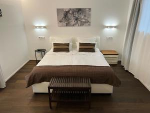 Postel nebo postele na pokoji v ubytování Weingut-Aparthotel Olinger
