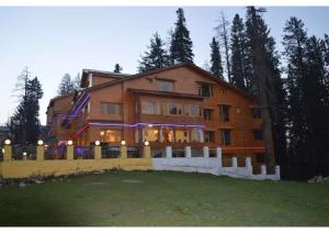 a large house with a fence in front of it at hotel khalil in Gulmarg