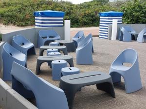 a group of benches and seats in a park at CVJM Freizeithaus MS Waterdelle in Borkum