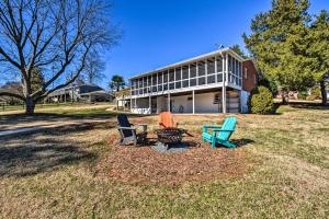 a group of chairs sitting in a field in front of a building at Stunning Seneca Home with Lake Keowee Access! in Seneca