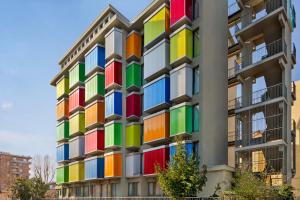 a building with a rainbow facade at Wyndham Garden Florence in Florence