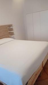Postel nebo postele na pokoji v ubytování B&B Denteferro