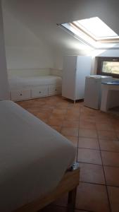 Kuchyň nebo kuchyňský kout v ubytování B&B Denteferro