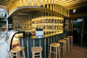 a bar in a restaurant with stools at 150 Peakway Mountain Resort in Dalaguete