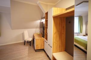 Postel nebo postele na pokoji v ubytování Hotel und Restaurant Kranichsberg