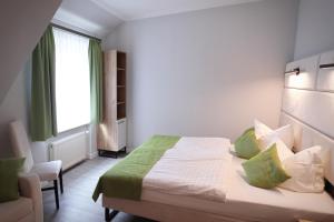 Postel nebo postele na pokoji v ubytování Hotel und Restaurant Kranichsberg