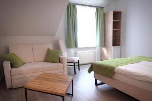 Postel nebo postele na pokoji v ubytování Hotel und Restaurant Kranichsberg