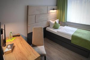 Postel nebo postele na pokoji v ubytování Hotel und Restaurant Kranichsberg
