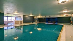 a large swimming pool in a hotel room at 12 Ullswater Suite - Whitbarrow Village in Penruddock