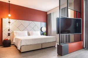 Postel nebo postele na pokoji v ubytování Quark Hotel Milano