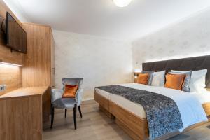 Cama ou camas em um quarto em Villa Westend Hotel an der Messe