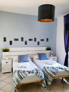Case Vacanza - La Rosa dei Venti tesisinde bir odada yatak veya yataklar