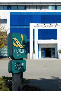 a sign for aquality hotel in front of a building at Quality Airport Hotel Stavanger in Sola