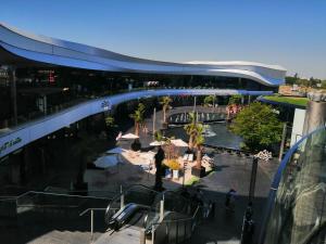 a view of a shopping mall with a building at KIEVAILLE in Plaisir