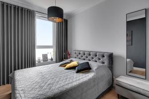 Postel nebo postele na pokoji v ubytování Apartament Gdańsk - In The Sky by Grand Apartments