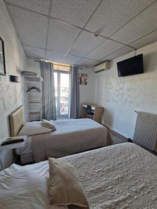 Ένα ή περισσότερα κρεβάτια σε δωμάτιο στο Hôtel du Nord +34 φωτογραφίες