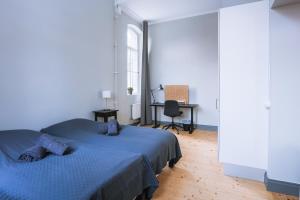 Letto o letti in una camera di Holterman Hostel