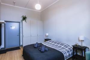 Letto o letti in una camera di Holterman Hostel