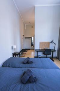 Letto o letti in una camera di Holterman Hostel