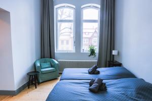Letto o letti in una camera di Holterman Hostel