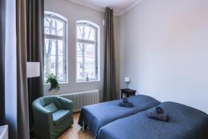 Letto o letti in una camera di Holterman Hostel