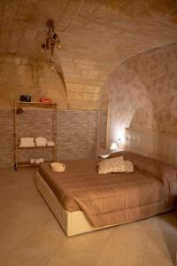 a bedroom with a large bed in a room at La casa della felicità apartment in Bari