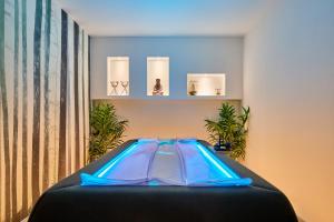an indoor trampoline in a room with plants at Hotel Iris Jesolo in Lido di Jesolo
