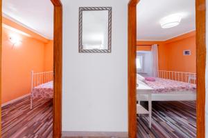 a mirror in a room with a bunk bed at Apartments Vera in Dubrovnik