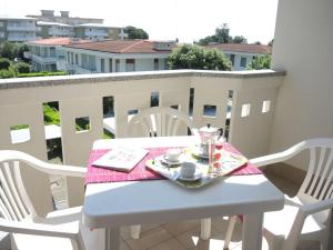 A balcony or terrace at Colorful modern flat next to the beach - Beahost