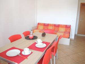 A seating area at Colorful modern flat next to the beach - Beahost