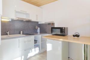 Kuchyňa alebo kuchynka v ubytovaní Residence de Lognan- Les Jorasses 27 - Happy Rentals