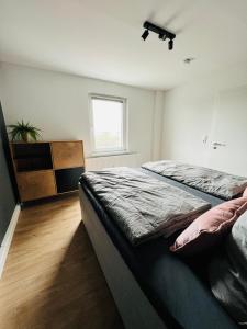 a bedroom with two beds and a window at Shadow Sleep 2.0 in Schonungen