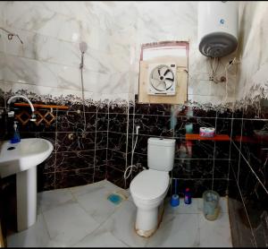 a bathroom with a toilet and a sink at Dahab in Dahab